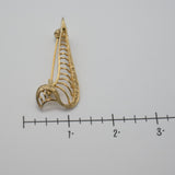 Vintage Gold‑Tone Openwork Brooch – Curved Filigree Design with Accent Stones