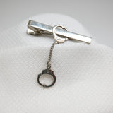 Vintage Gold‑Tone Tie Clip w/ Dangling Handcuff Charm – 2"