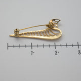 Vintage Gold‑Tone Openwork Brooch – Curved Filigree Design with Accent Stones