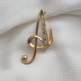 Gold‑Tone Script Initial “A” Brooch – Rhinestone Accent – 2" x 1" – .2 oz