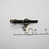 Vintage Gold‑Tone Tie Clip w/ Dangling Handcuff Charm – 2"
