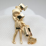 Vintage Gold‑Tone Shopper & Dog Brooch – 2.75"